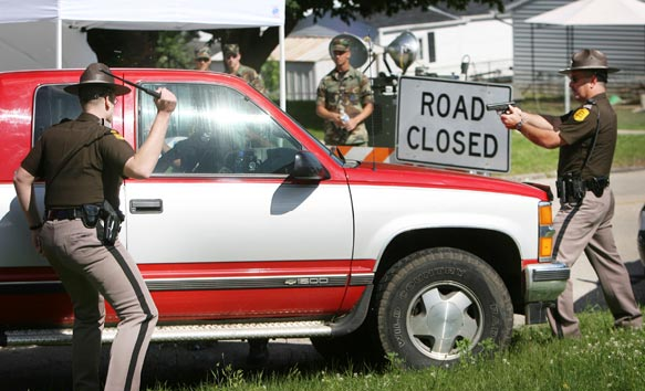 Police stop a home owner from returning. Â©AP